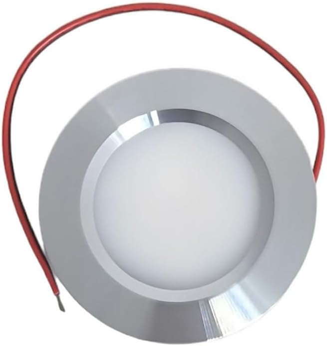Round metallic object with red cable on a white background