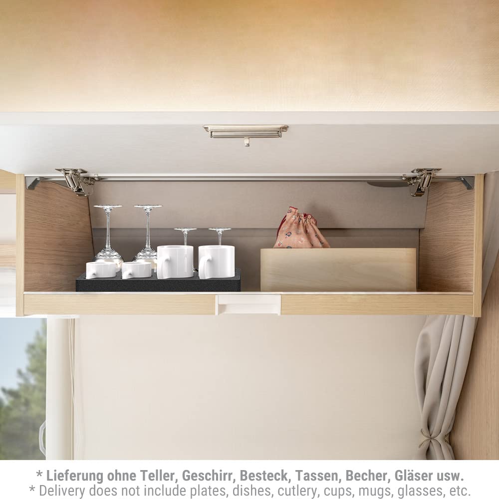 Under-cabinet storage compartment with kitchen items inside, including glasses and containers.
