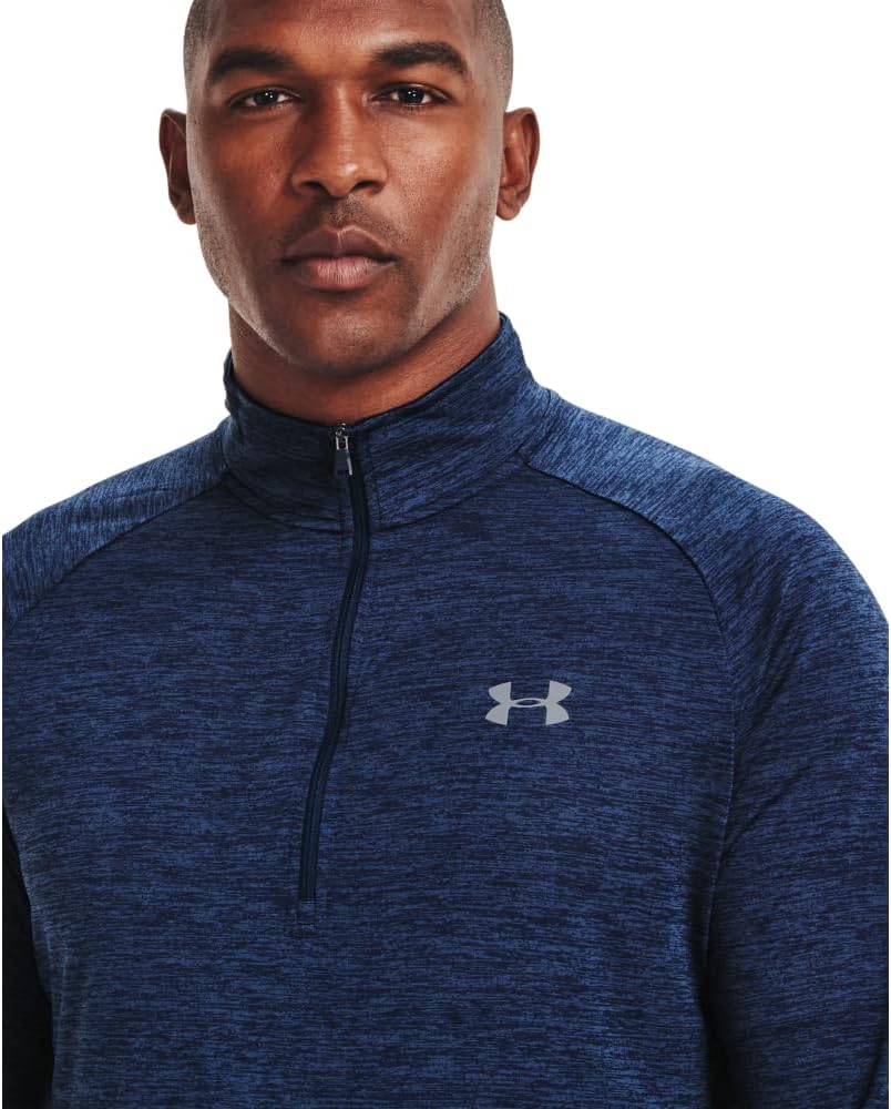 Man wearing a blue Under Armour quarter-zip sweatshirt on a white background