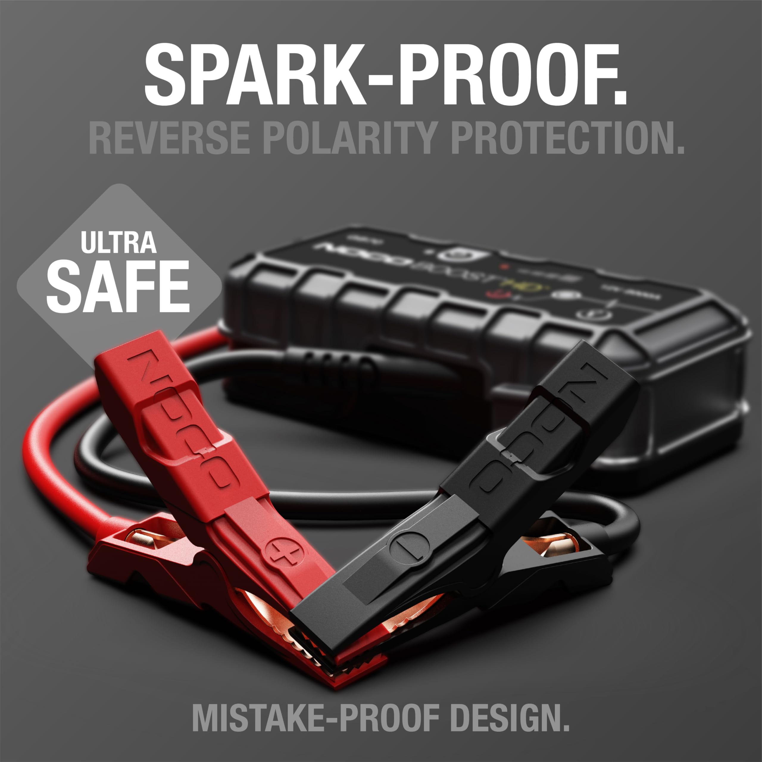Jump starter with red and black cables on a gray background, featuring 'Spark-Proof' and 'Ultra Safe' text.
