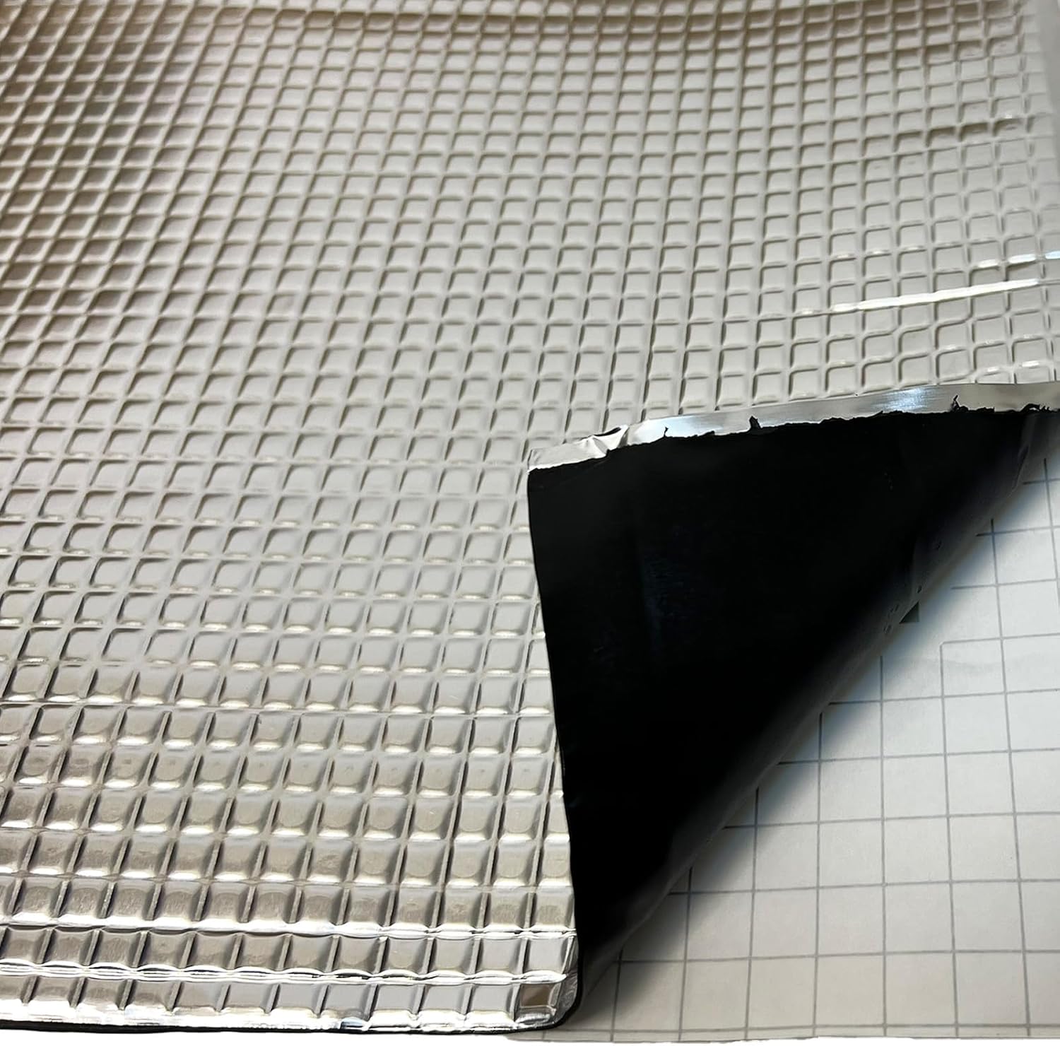 Metallic grid sheet on a textured surface