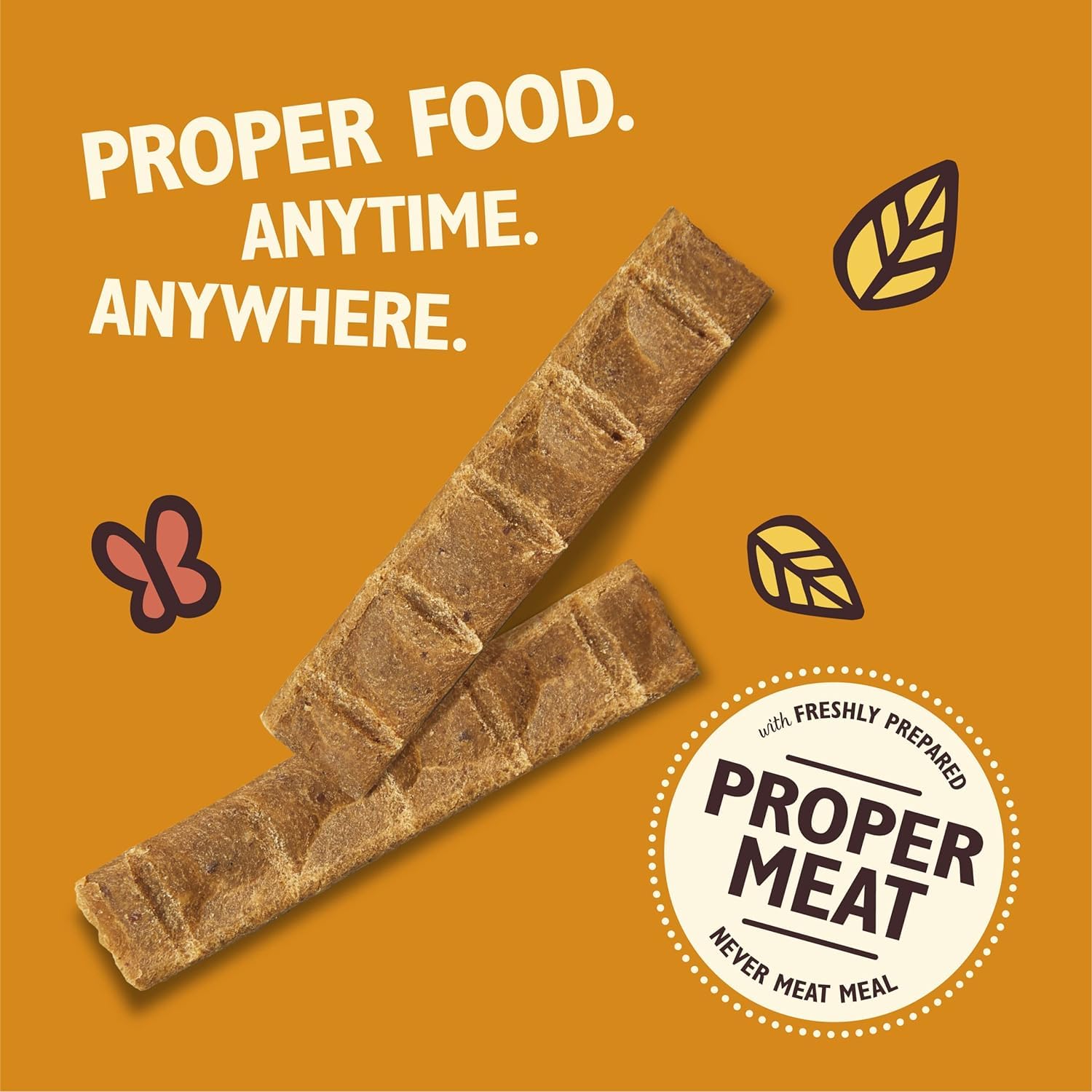 Dog treats with text 'Proper Food. Anytime. Anywhere.' on an orange background