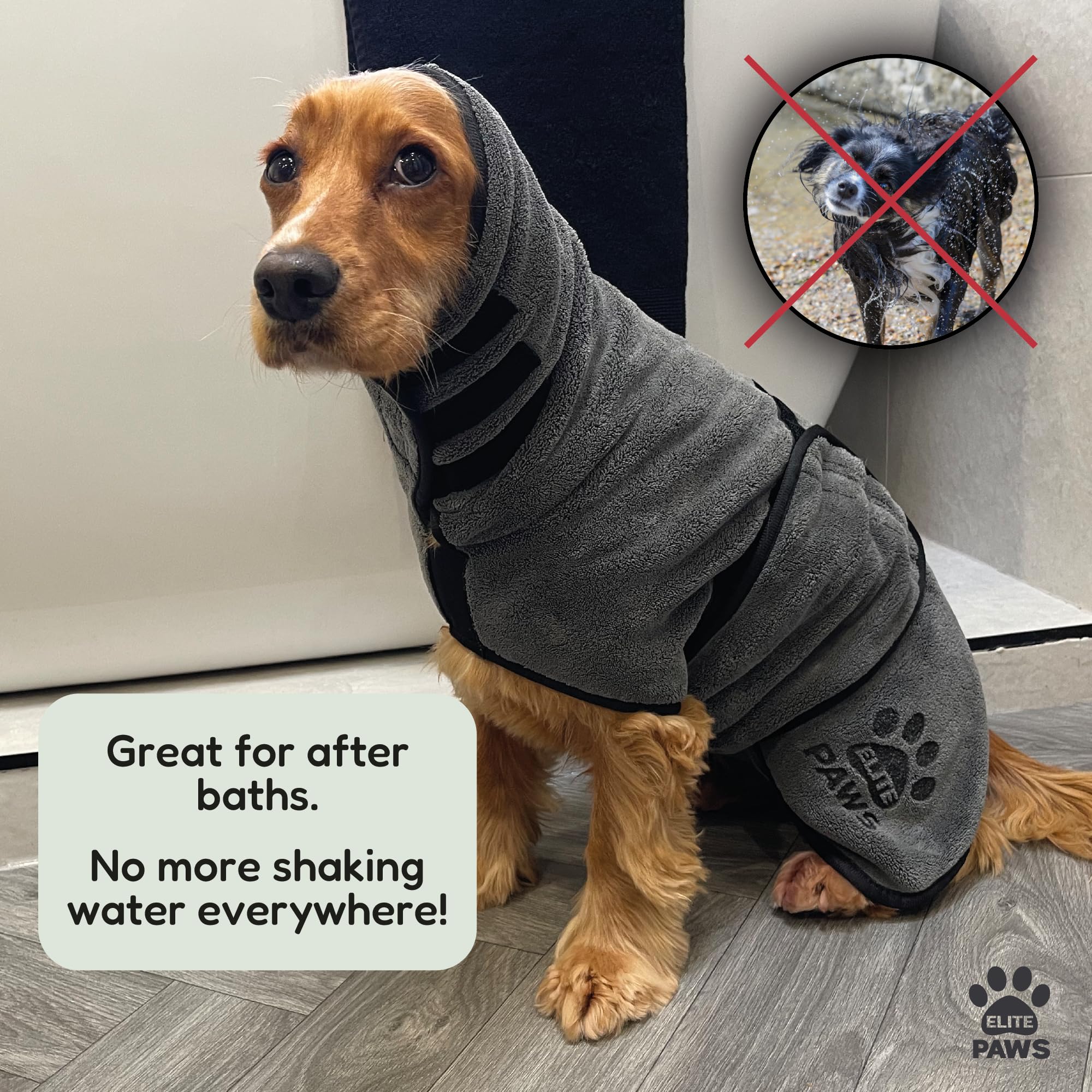 Dog wearing a gray hoodie with paw print design, sitting on a wooden floor.