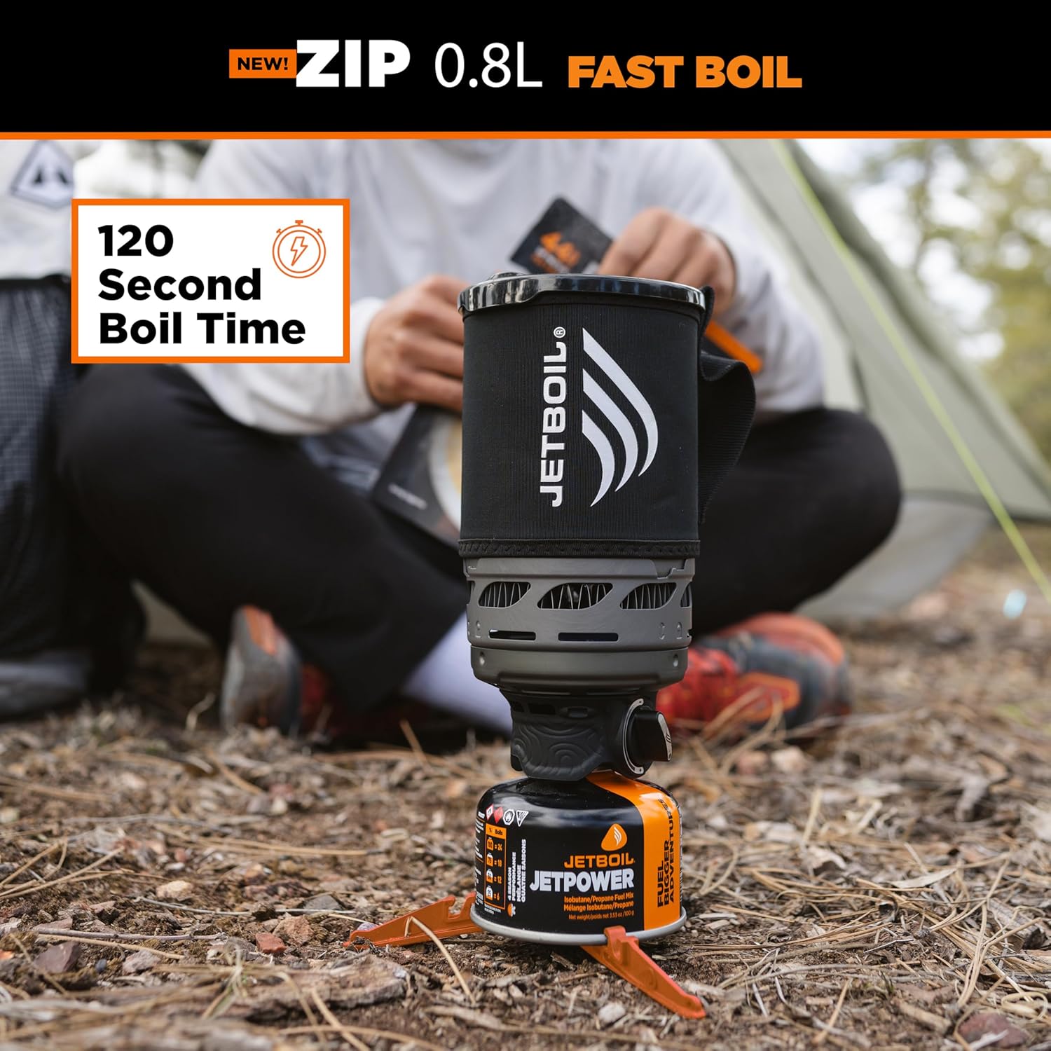 Jetboil camping stove with person in background, highlighting fast boil time feature.