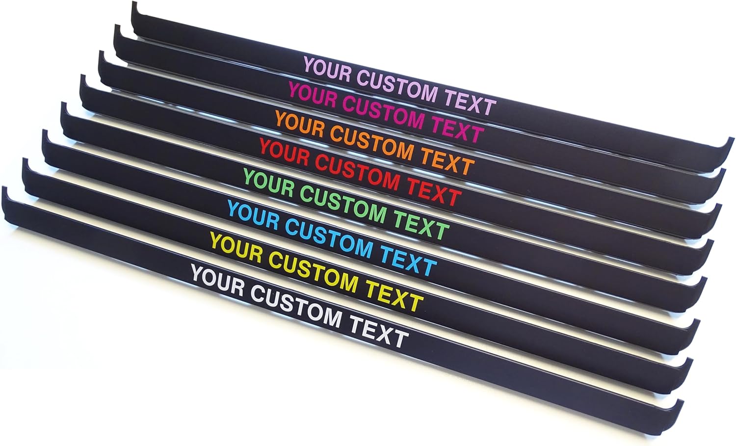 Set of black metal strips with customizable text in various colors on a white background