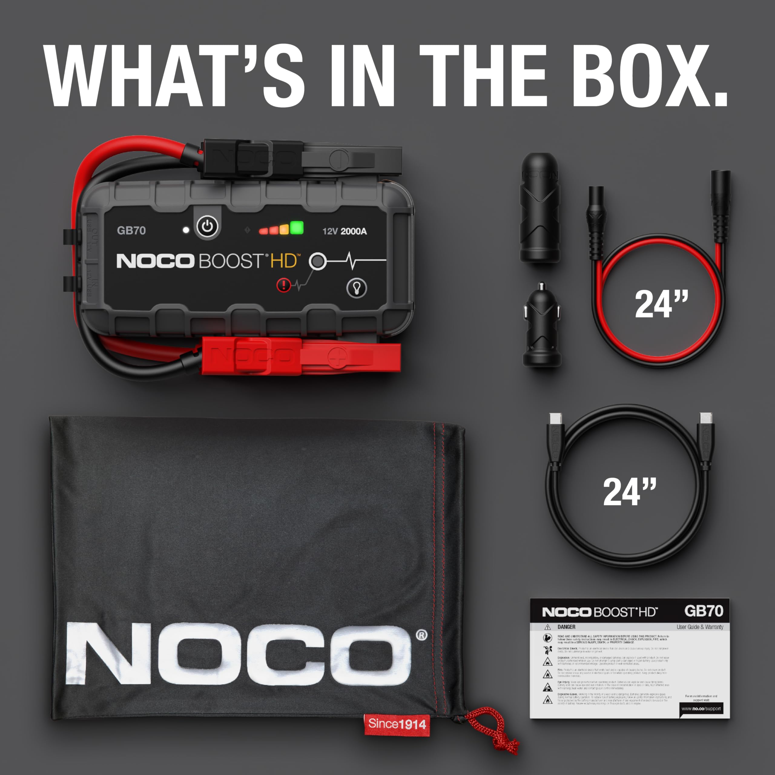 NOCO Boost HD jump starter kit with cables and cover on a dark background