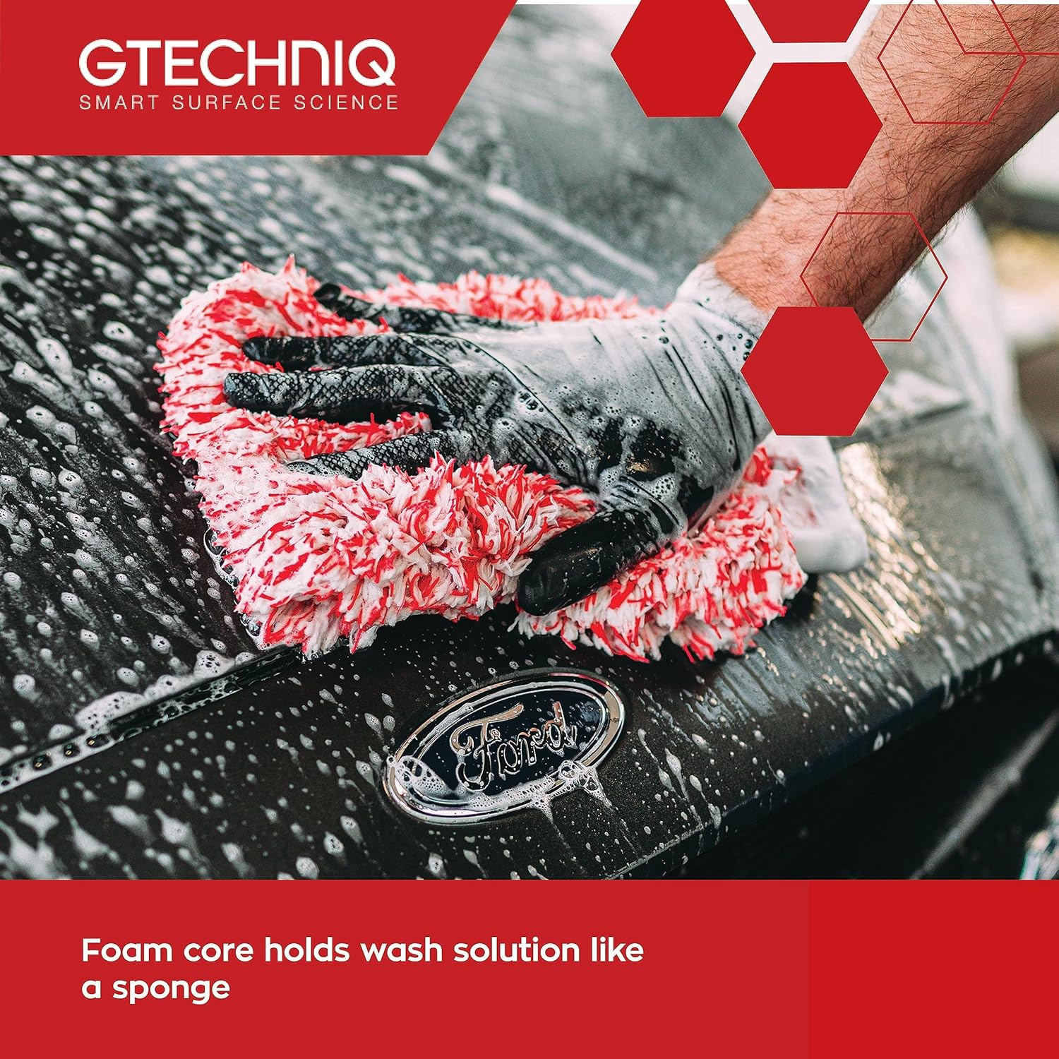 Person cleaning a car with a red and black microfiber towel, Gtechniq logo visible.