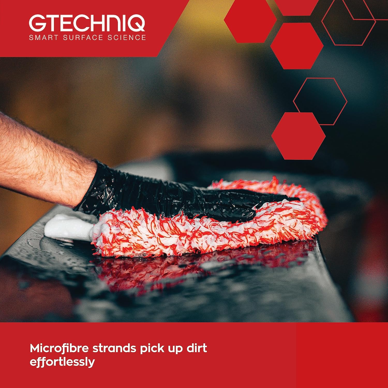 Microfibre cleaning cloth with Gtechniq branding on a dark surface