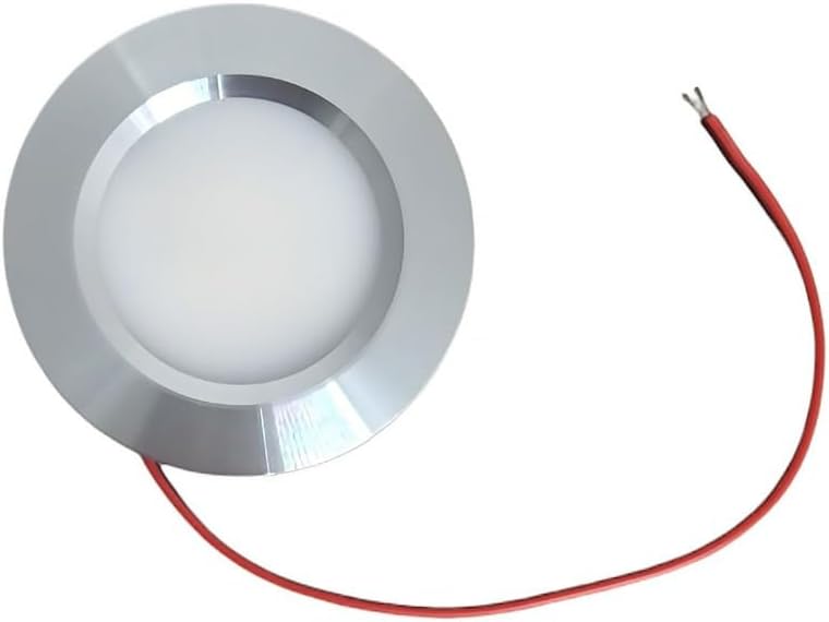 Round metallic object with a red wire on a white background