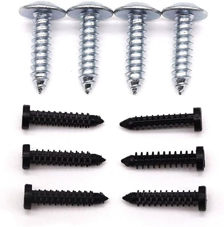 Set of screws with metal and black varieties on a white background