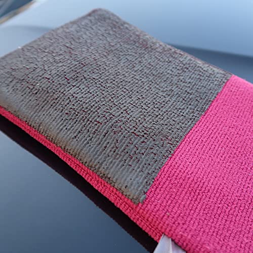 Pink and gray microfiber cloth on a reflective surface