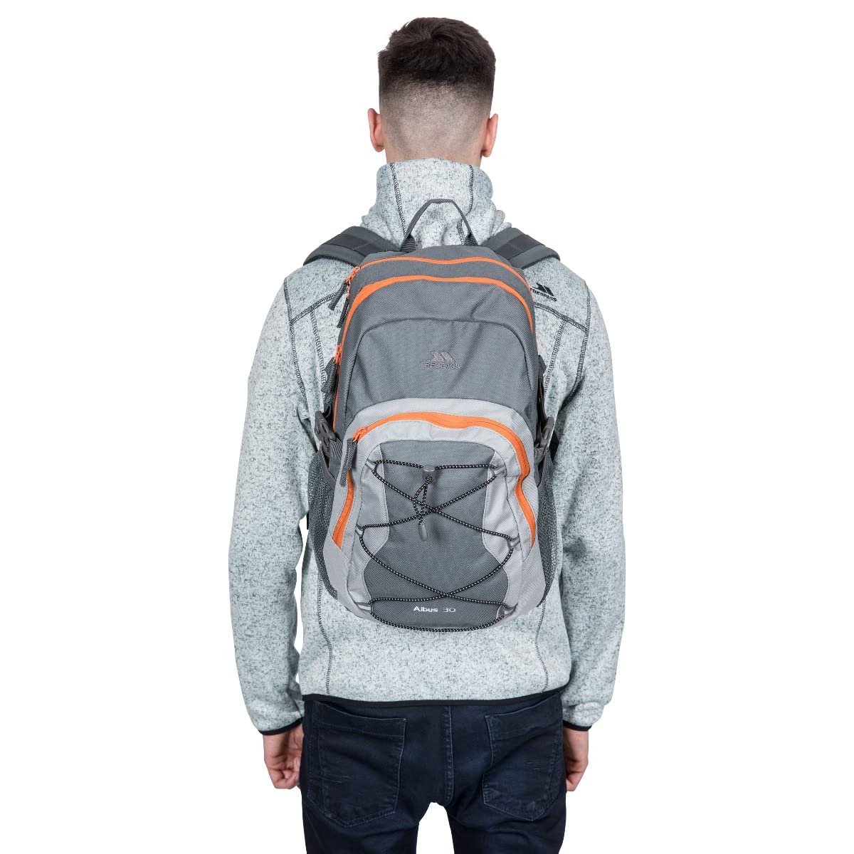 Person wearing a gray and orange backpack on a white background