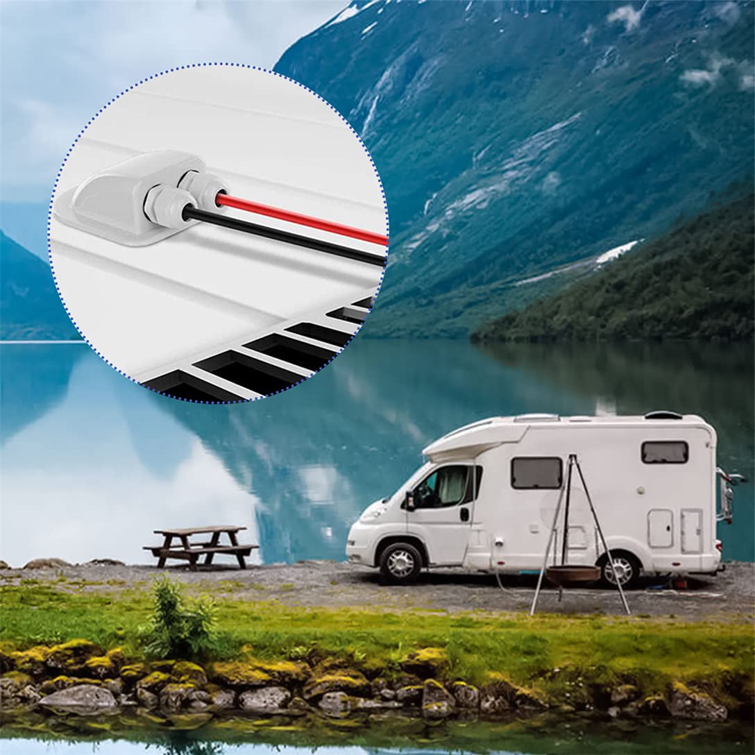 White RV parked by a scenic lake with mountains in the background, featuring a close-up of a wiring grommet.