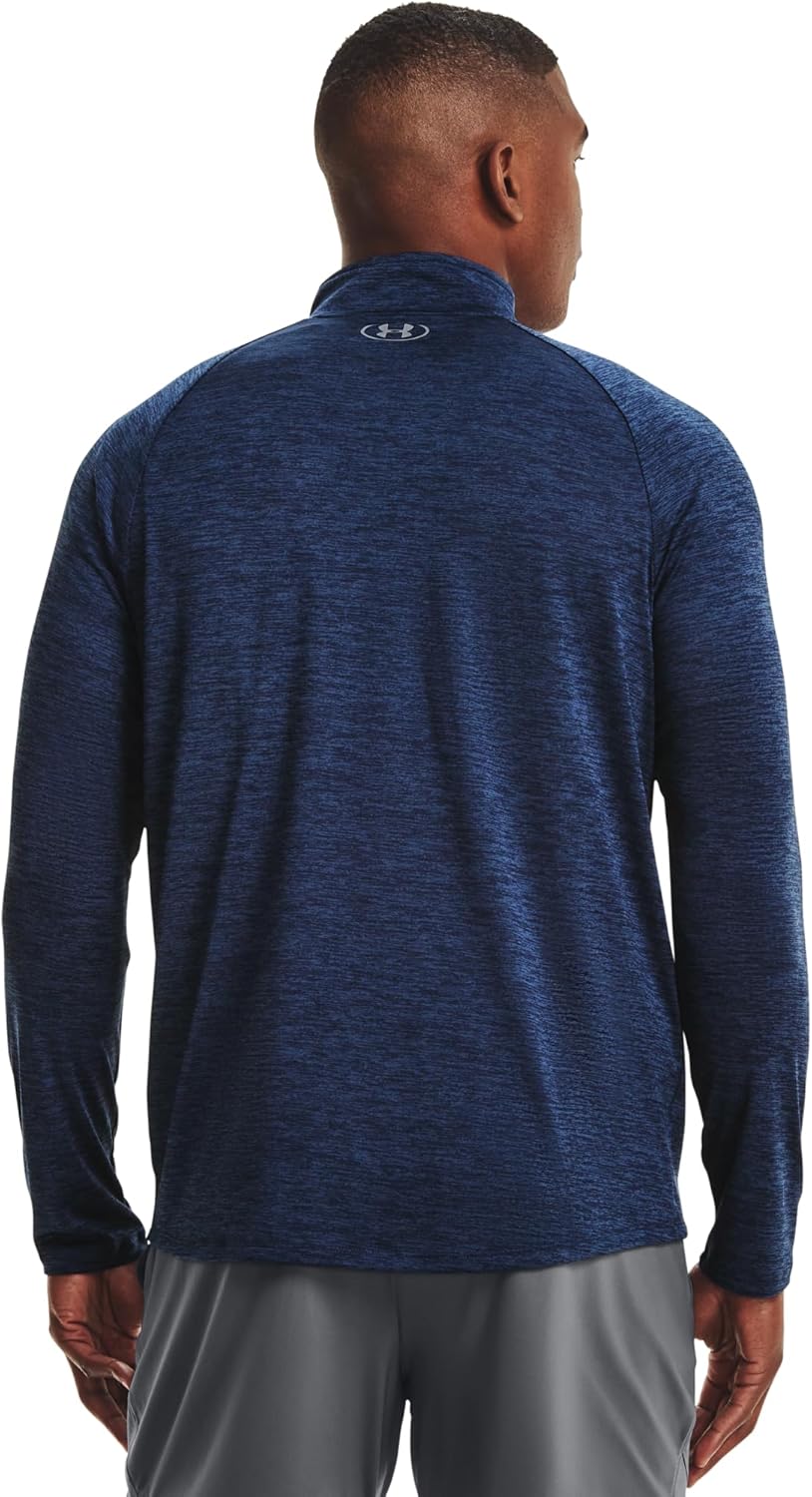 Person wearing a blue long-sleeve athletic shirt with a brand logo on the back.
