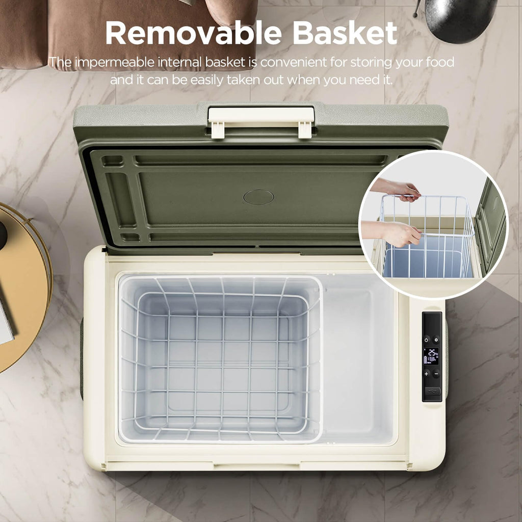 Portable refrigerator with a removable basket feature on a marble surface.
