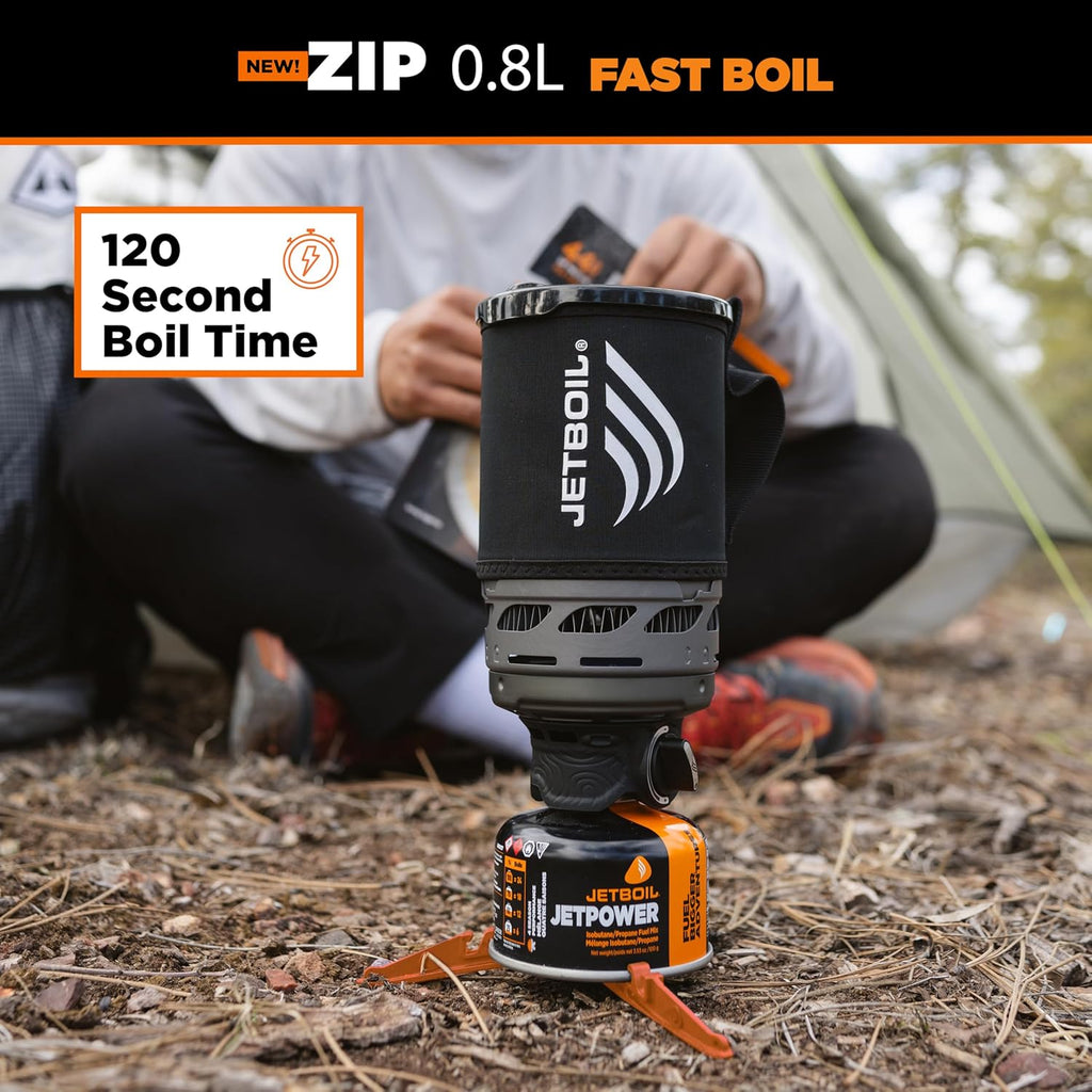 Jetboil camping stove with person in background, highlighting fast boil time feature.