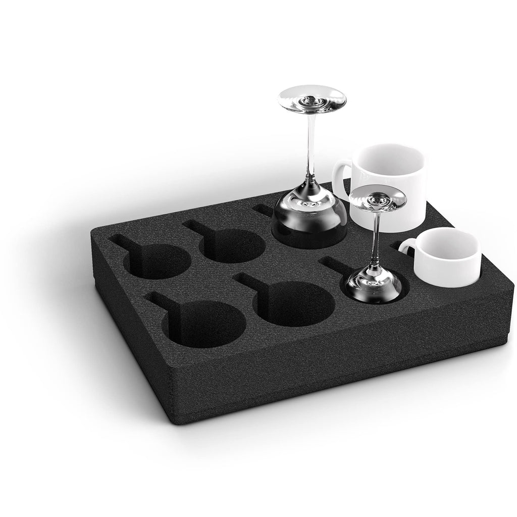 Black foam block with cutouts for holding cups and glasses on a white background
