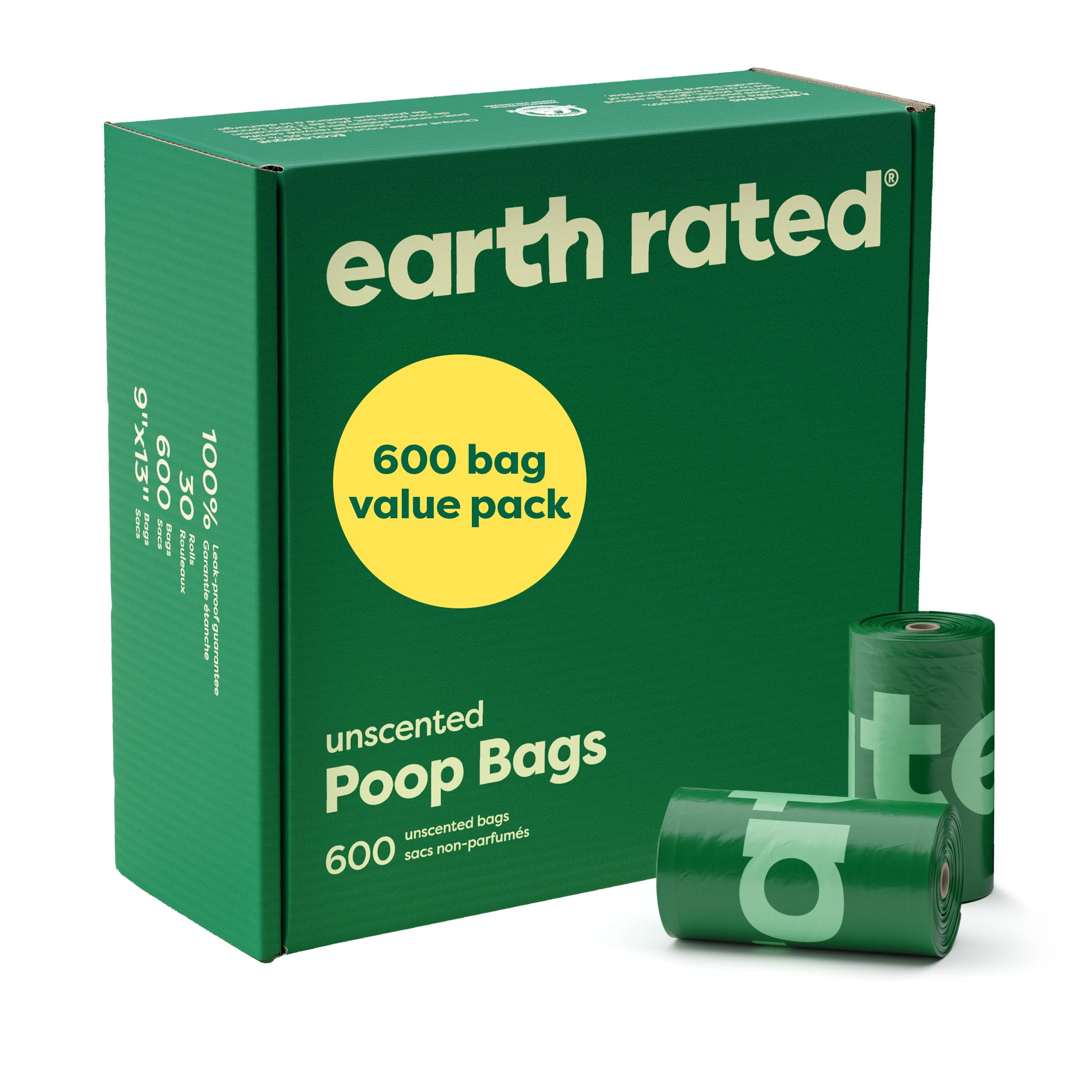 Green box of earth rated poop bags with two rolls in front on a white background