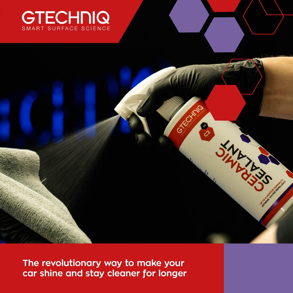 Gtechniq ceramic sealant spray bottle being used on a car surface with brand logo and text.