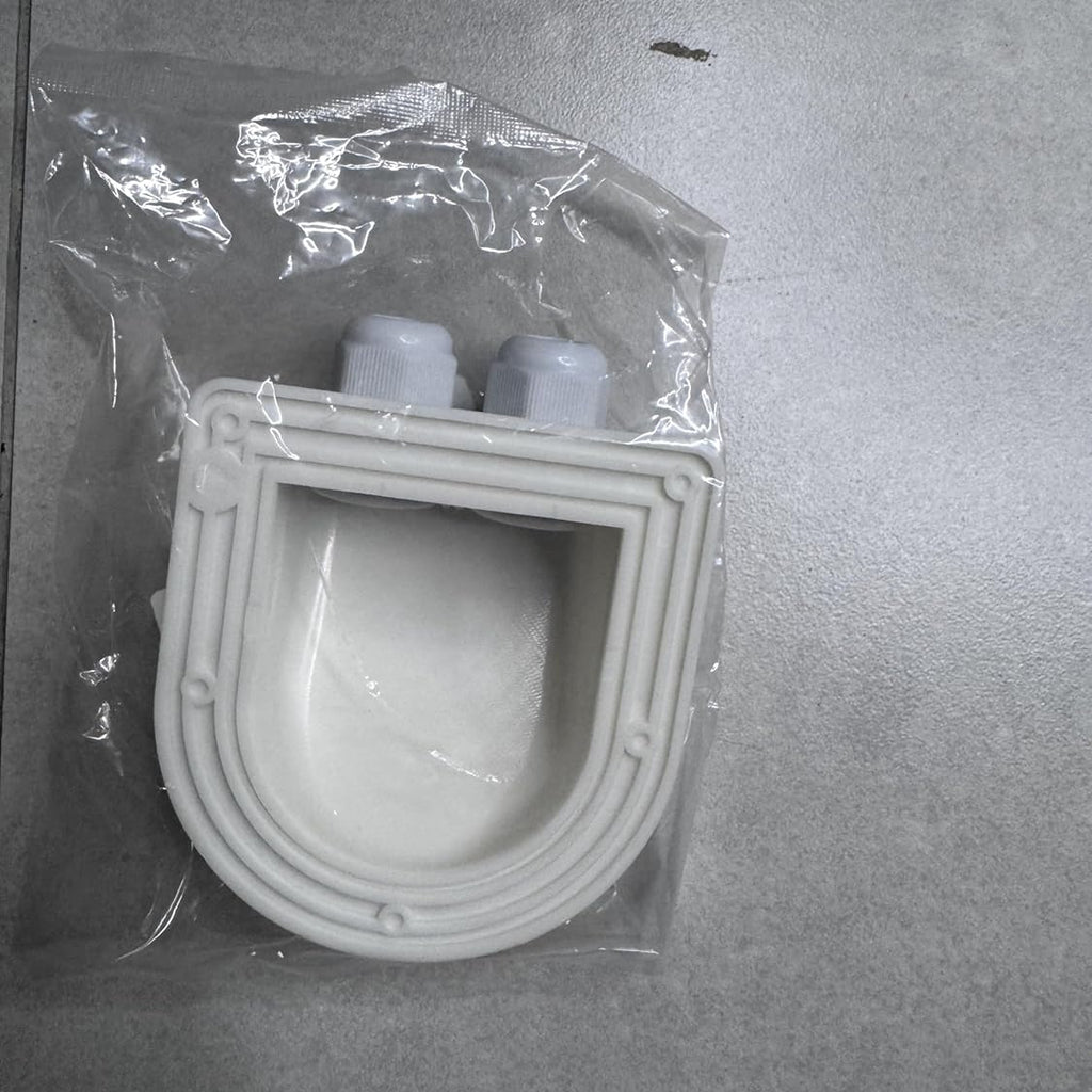 White plastic component in clear packaging on a gray surface