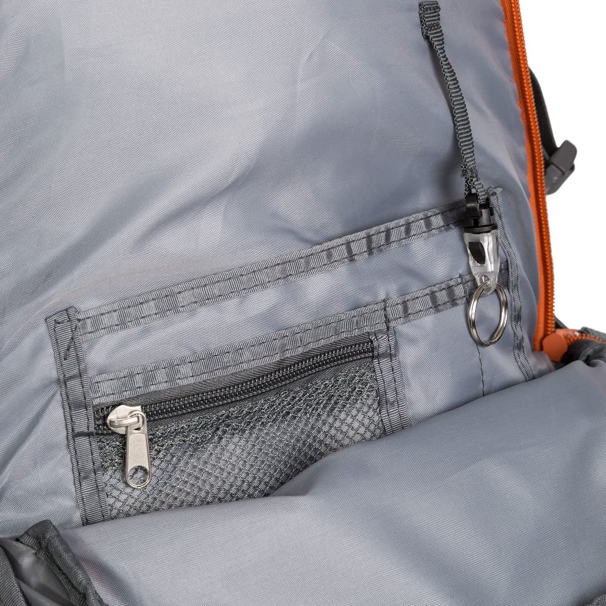 Close-up of a gray backpack with a zipper pocket and orange accents.